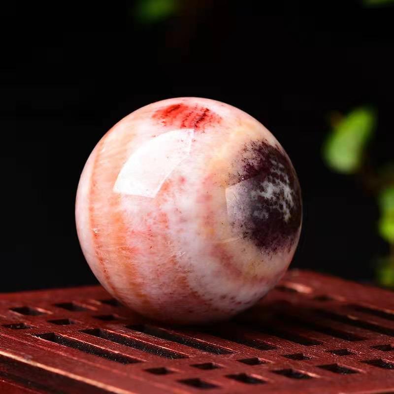 Rhodochrosite sphere-live