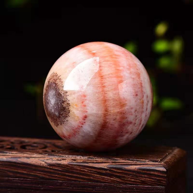 Rhodochrosite sphere-live