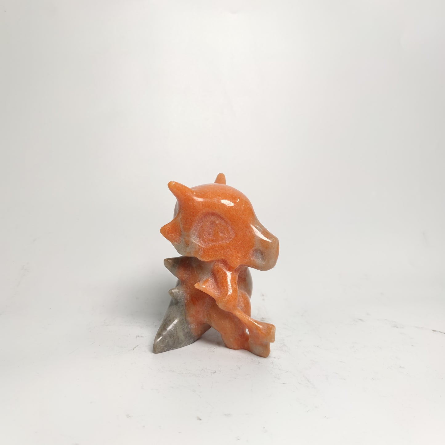 sunset red stone Pokemon carving