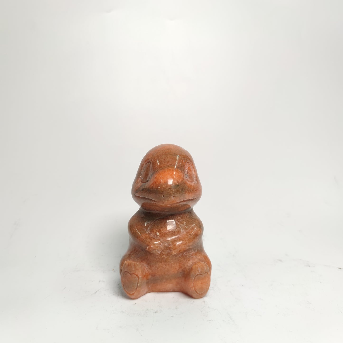 sunset red stone Pokemon carving