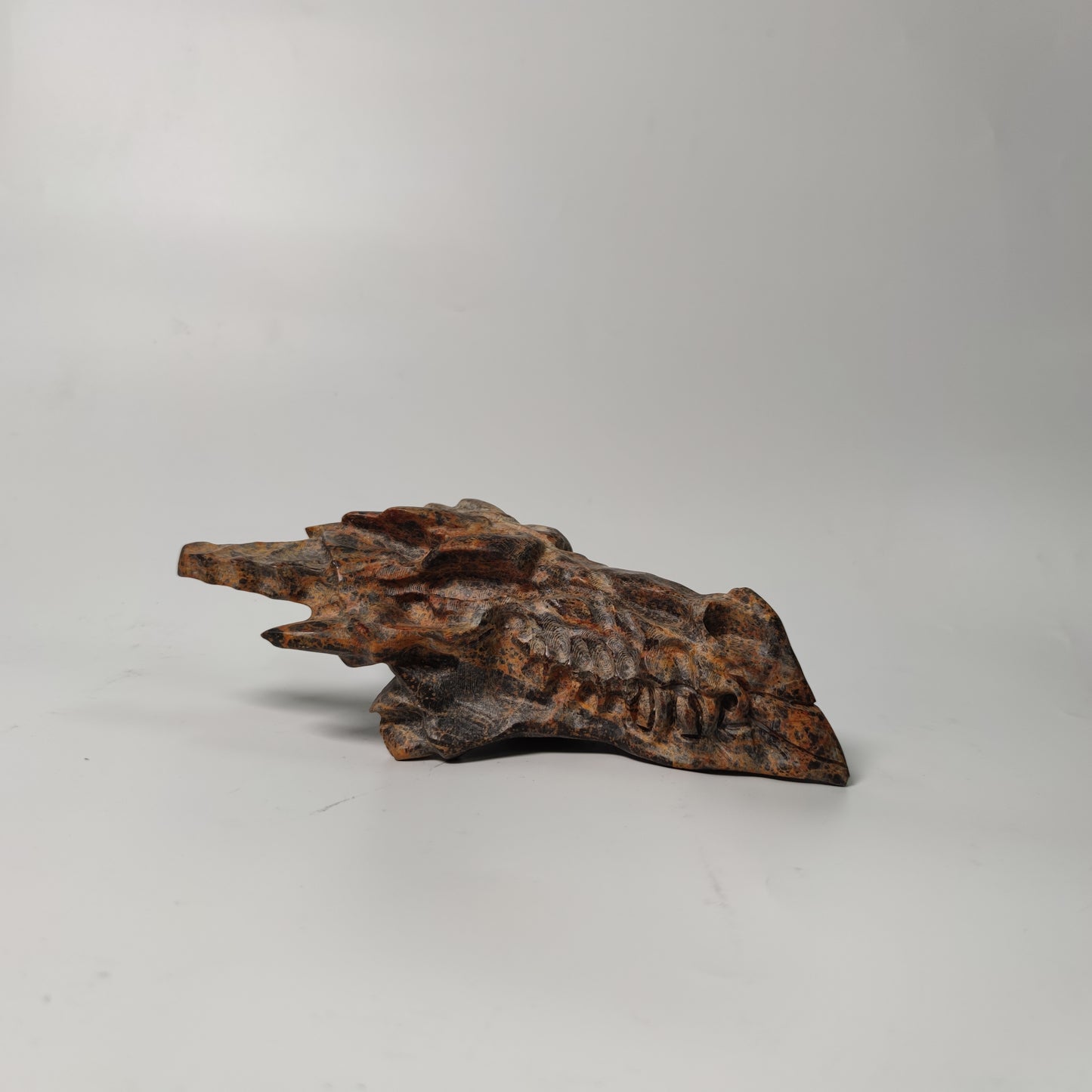 Brown calcite dragon head