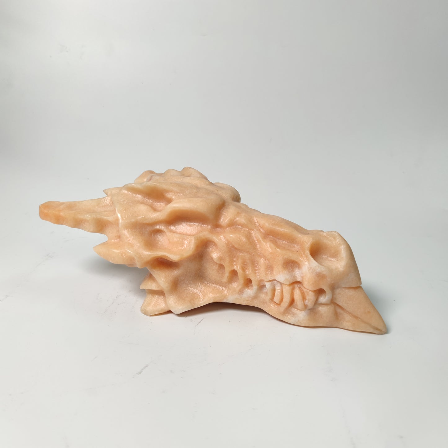 Orange calcite dragon head