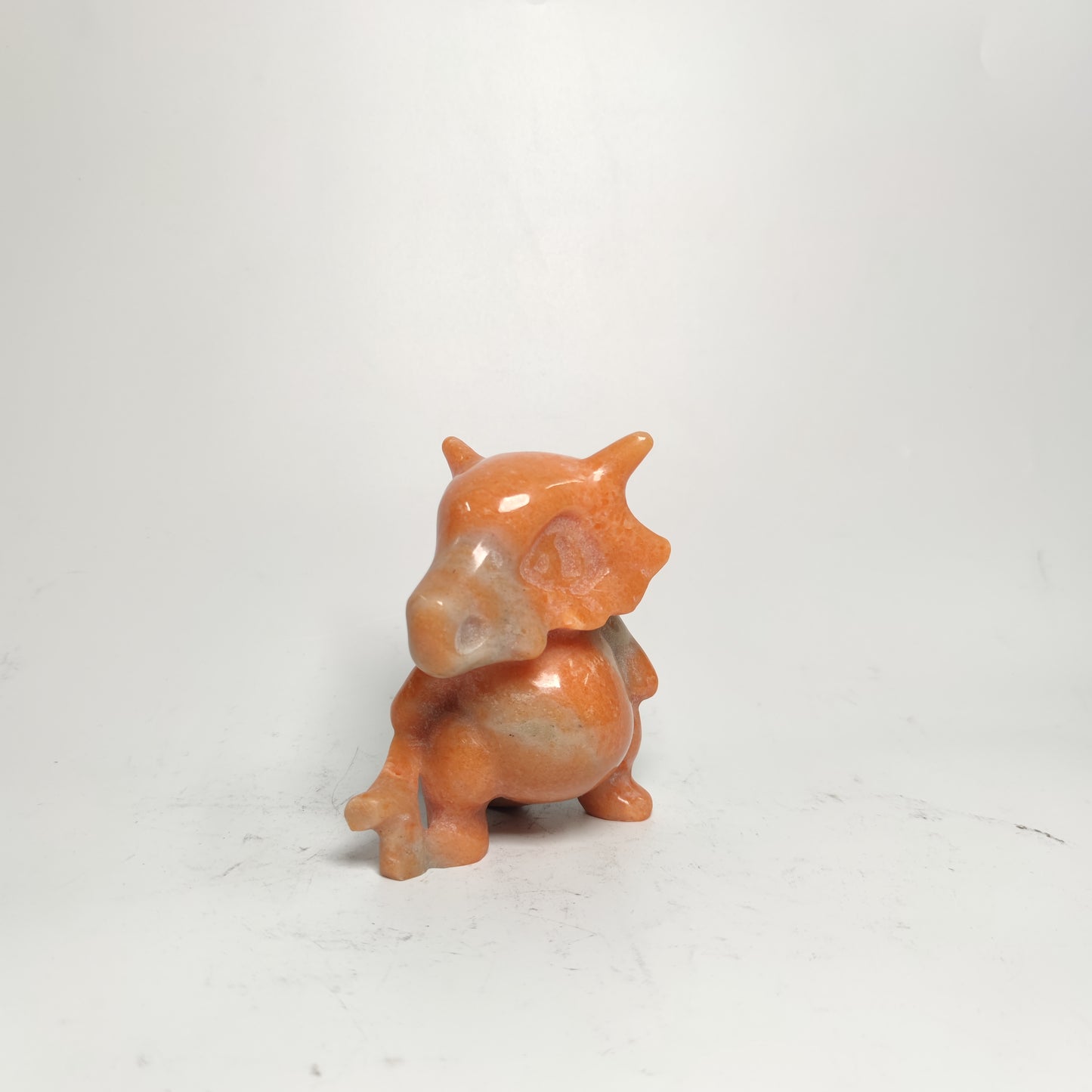 sunset red stone Pokemon carving