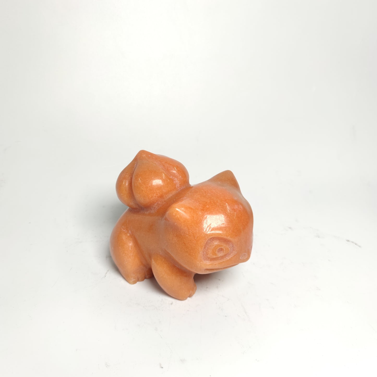 sunset red stone Pokemon carving